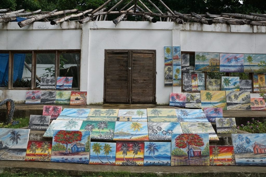Stand with paintings of palmtrees