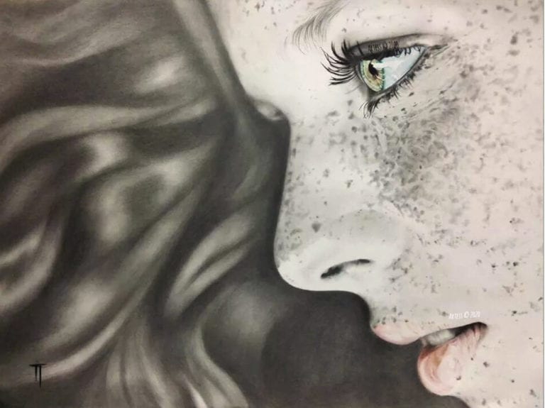 Side portrait of woman with freckles